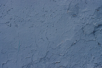 Abstract background of blue damaged plaster.