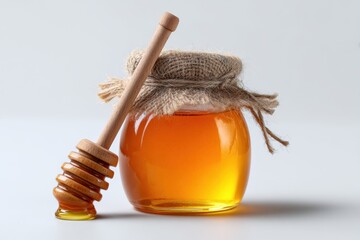 Arrangement featuring honey jar on light backdrop
