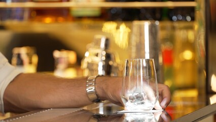 Closeup bartender hand serving in fresh soda gas texture into glass of drink advertisement serving...