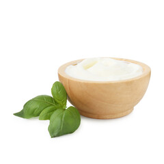 Tasty yoghurt in bowl and basil isolated on white