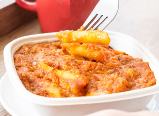 Vegan Impossible Bolognese Penne Pasta in bowl close up view of Delicious Italian Dish