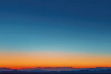 Obraz premium Orange Gradient Sunset Beneath Blue Sky