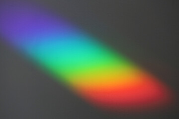 Soft focus rainbow neon noise grain blur texture prism reflection wall. Light and shadow smoke...