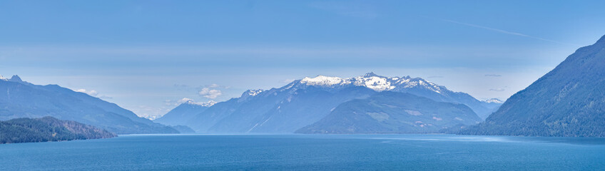 Scenic Mountain and Lake View in British Columbia, Canada Under Clear Blue Sky