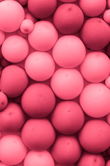 An interior or exterior wall decorated with many red balloons as a background