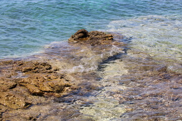Rocky sea coast with clear turquoise ocean water, Murter, Croatia