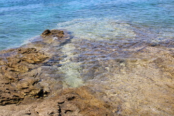 Rocky sea coast with clear turquoise ocean water, Murter, Croatia