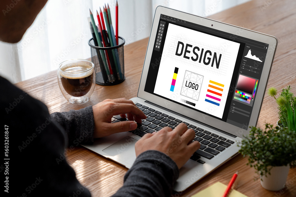 Aufkleber graphic designer software for modern design of web page and commercial ads showing on the computer s