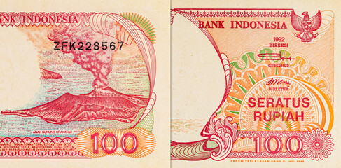 Fragment of a 100 rupiah banknote from Indonesia, depicting the Pinisi Boat. Paper money from Indonesia.