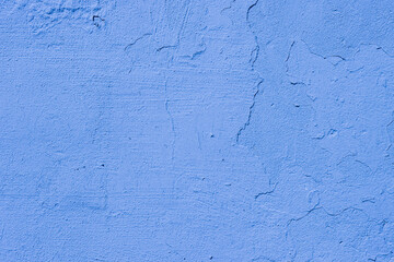 Old damaged blue wall close up.