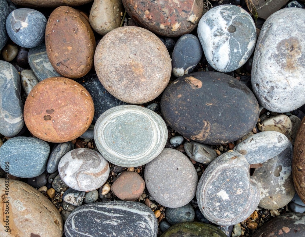 Poster close up of assorted stones with textures and round shapes in various colors