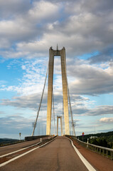 Högakustenbron: Majestic Cable-Stayed Bridge Over Ångermanälven River Under Dynamic Skies –...