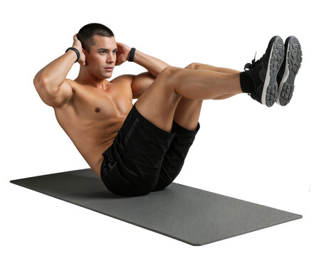 young man doing situps and crunches on a mat for fitness