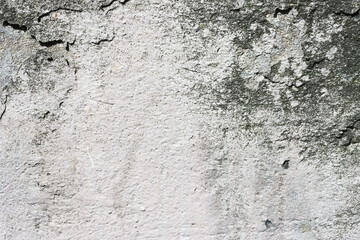 Close-up of damaged grey concrete wall.