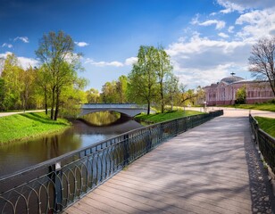 Fototapeta premium sestroretsky public park and bridge over river sestra at spring in klin town moscow region russia