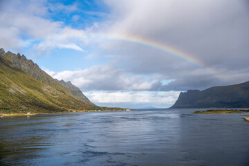Vibrant Rainbow Over Nordic Fjord: Majestic Mountains, Serene Waters & Dramatic Skies – A Symbol...