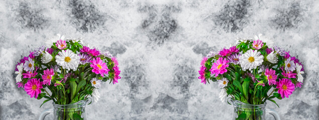 bouquet of white and pink flowers on a vintage background in a glass vase