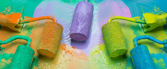 Paint rollers with paint on a bright background. Repair concept.