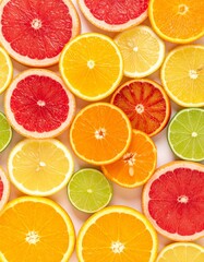 Obraz premium Assorted Citrus Fruits on White Background Featuring Orange Lemon Grapefruit