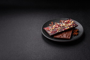 Bar sweet craft artisan chocolate with dried fruits made at home. Craft chocolate