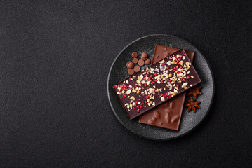 Bar sweet craft artisan chocolate with dried fruits made at home. Craft chocolate