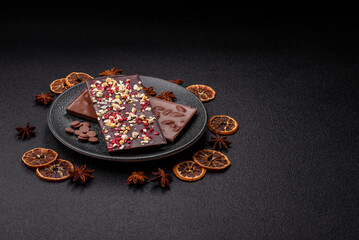 Bar sweet craft artisan chocolate with dried fruits made at home. Craft chocolate