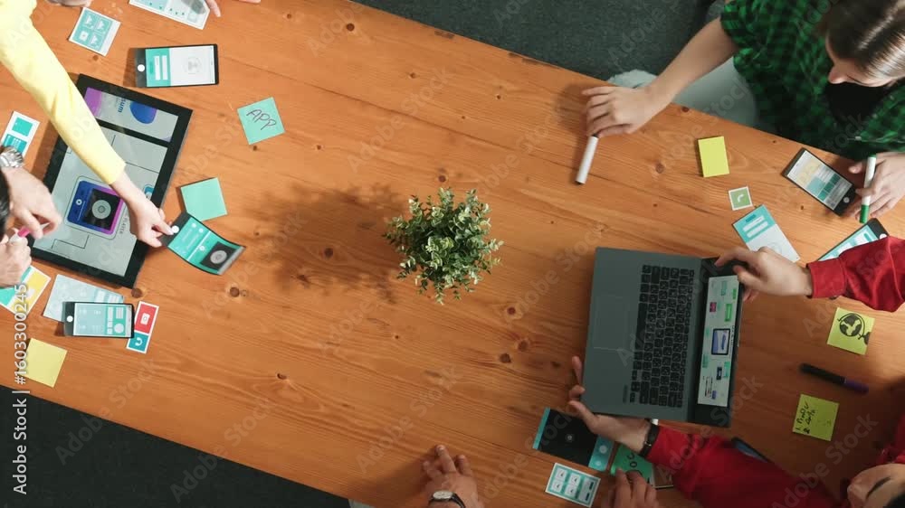 Poster programmer sharing ux ui design for mobile phone interface idea with software developer at meeting w