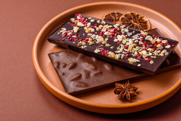Bar sweet craft artisan chocolate with dried fruits made at home. Craft chocolate