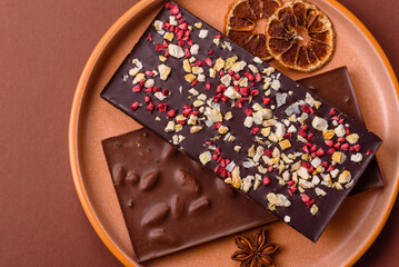 Bar sweet craft artisan chocolate with dried fruits made at home. Craft chocolate