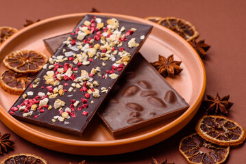 Bar sweet craft artisan chocolate with dried fruits made at home. Craft chocolate