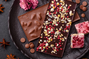 Bar sweet craft artisan chocolate with dried fruits made at home. Craft chocolate