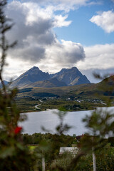Framed Nordic Vista: Majestic Mountains, Serene Lake & Remote Village Under Dynamic Skies &ndash; Perfect for Travel