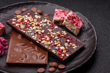Bar sweet craft artisan chocolate with dried fruits made at home. Craft chocolate