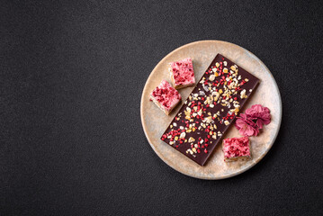 Bar sweet craft artisan chocolate with dried fruits made at home. Craft chocolate