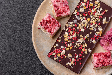 Bar sweet craft artisan chocolate with dried fruits made at home. Craft chocolate
