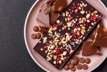 Bar sweet craft artisan chocolate with dried fruits made at home. Craft chocolate