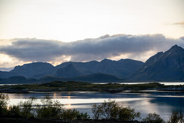 Serene Nordic Fjord Landscape: Reflective Waters, Dark Islands & Majestic Mountains at Dawn/Dusk - Tranquil Beauty