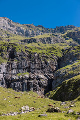Mountain range in Switzerland above Lake Oeschinen in Bern. This beautiful hike above the swiss mountain lake is famous on Instagram.