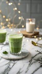 Elegant iced matcha latte on marble with bokeh lights