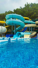 Experience the excitement of thrilling water slides and enjoy the refreshing clear blue pool at an...