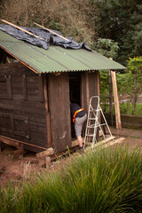 man building his own shack