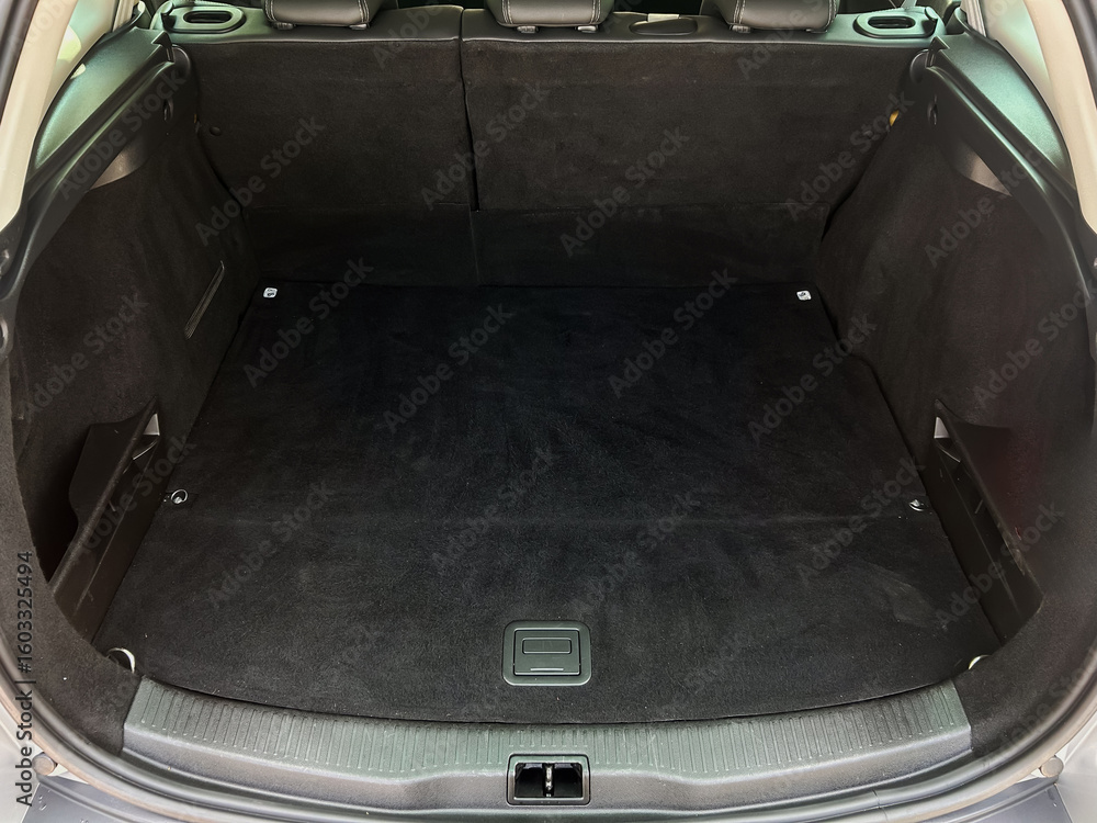 Poster the car trunk interior is designed to be both spacious and versatile, showcasing an efficient layout