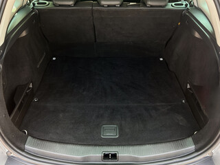 The car trunk interior is designed to be both spacious and versatile, showcasing an efficient...