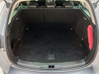 The spacious and impeccably clean interior of the car trunk is perfectly designed for both thrilling adventures and everyday practical use, making it a versatile choice for diverse lifestyles