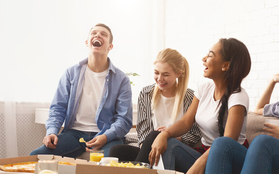 Best friends. Teen friends having home party, eating pizza and chatting - Powered by Adobe