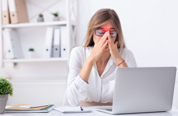 Sinusitis. Sad Businesswoman Suffering From Sinus Pain Touching Red Zone On Nosebridge Sitting At...