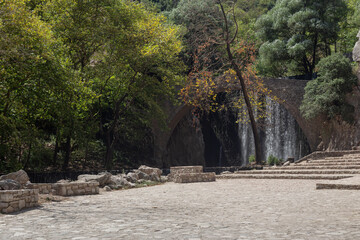 Stone arch bridge of Paleokaria and waterfall (Trikala, Greece)