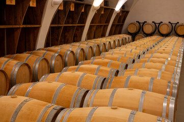 Visit of undergroud caves witn wine barrels in Cahors wine production area, red malbec wines, wine tasting in chateau, France