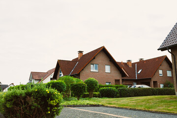 This picturesque neighborhood features charming houses amid vibrant landscaping, creating a serene atmosphere that highlights the delightful charm of community living in harmony with nature