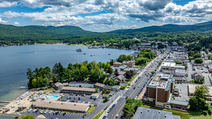 July 21, 2025 - Lake George, NY, USA.  Sunny afternoon summer aerial image of the south end of Lake George and Canada Street, Lake George, NY, USA.